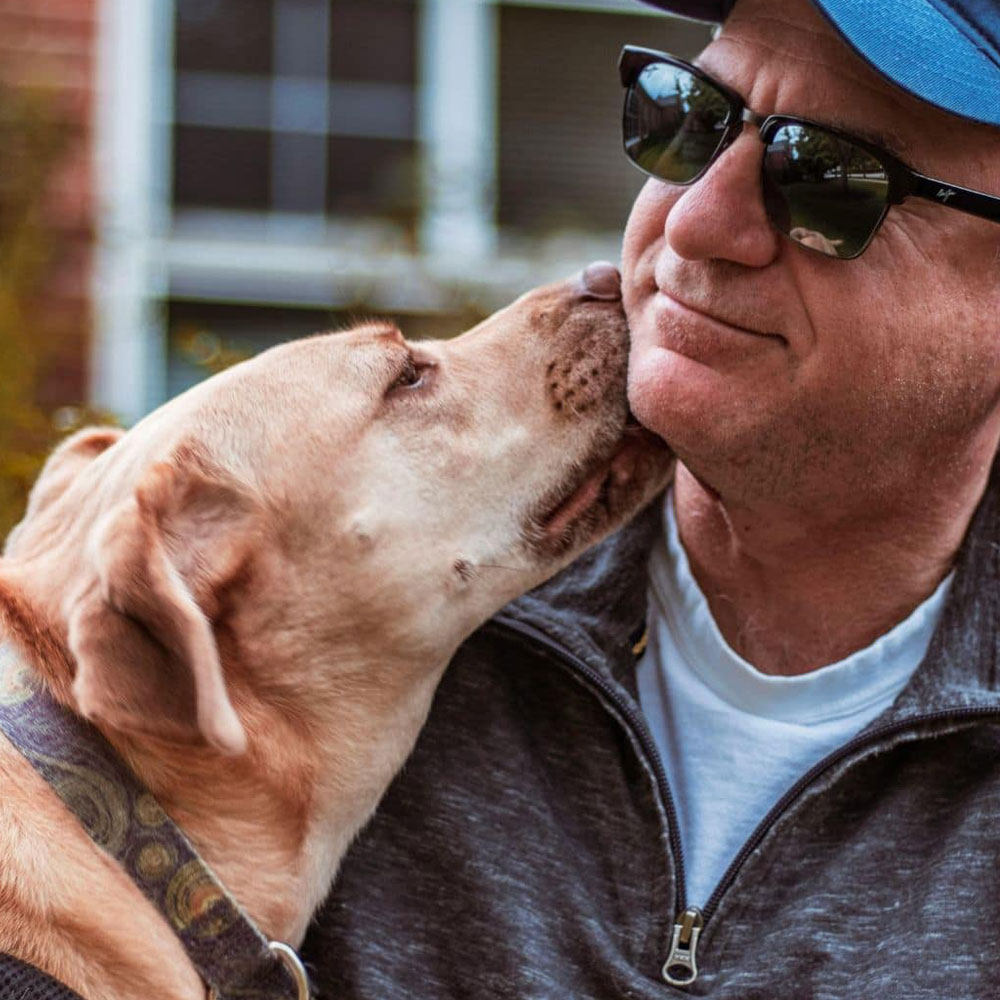 Old man caring his dog